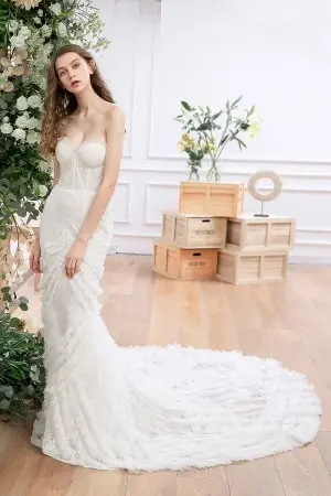 Romantic lace and ruffled tulle long train bridal dress