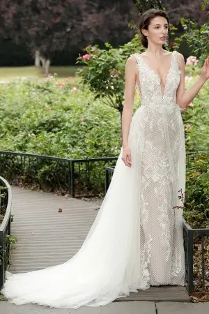 plunging neckline beige wedding dress with overskirt